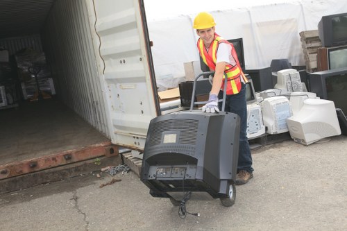 Staff inspecting waste containers for a commercial rubbish removal complaint