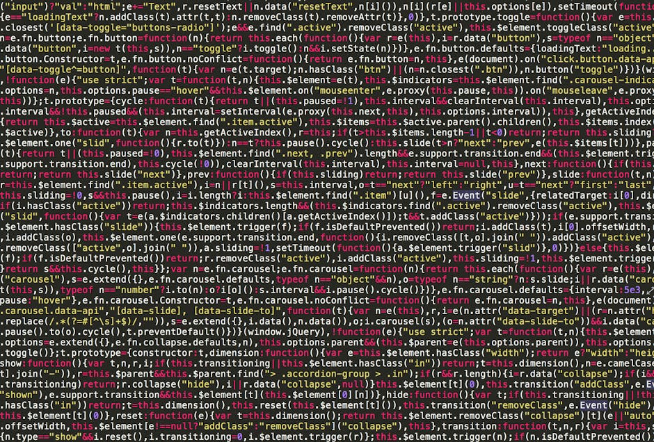 A photograph of a computer screen displaying lines of colorful programming code written in a text editor. The code features syntax highlighting with various colors such as yellow, purple, blue, and gr